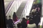 Crowded escalator in China shopping mall abruptly changes direction - 1
