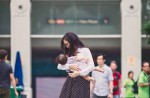 Woman breastfeeds baby at Raffles Place - 7