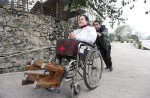 Village doctor without legs makes house calls on wooden benches - 2