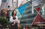 Woman breastfeeds baby at Raffles Place - 0