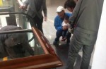 Toddler's fingers severed after running backwards up escalator in China - 2