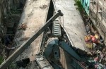 Flyover collapses in Indian city, trapping many - 17