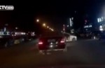 Child flung out of car in China as driver makes sharp turn - 1