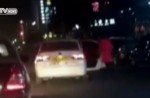 Child flung out of car in China as driver makes sharp turn - 10