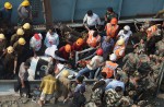 Flyover collapses in Indian city, trapping many - 6