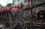 Flyover collapses in Indian city, trapping many - 5