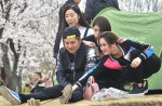 Chinese tourists kick and climb cherry blossom trees to snap photos  - 4