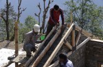 A year on, millions of Nepal quake survivors wait for aid - 14