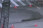 Video captures sinkhole collapsing in middle of busy road - 10