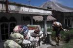 Ash-covered dog seen in aftermath on Mount Sinabung volcano eruption - 7