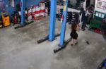 Woman uses umbrella to stop group of men from fighting at Jurong car workshop - 12