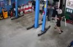 Woman uses umbrella to stop group of men from fighting at Jurong car workshop - 14