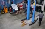 Woman uses umbrella to stop group of men from fighting at Jurong car workshop - 17