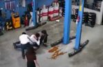 Woman uses umbrella to stop group of men from fighting at Jurong car workshop - 20