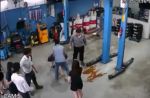 Woman uses umbrella to stop group of men from fighting at Jurong car workshop - 21