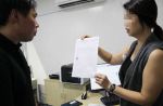 Woman uses umbrella to stop group of men from fighting at Jurong car workshop - 6