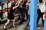 Woman uses umbrella to stop group of men from fighting at Jurong car workshop - 25