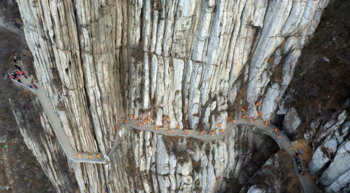 Children scale 800-metre cliff on way to school