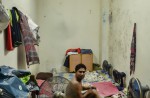 Foreign workers living in bin centres - 11