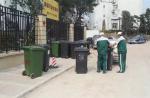 Trash cans barricade badly parked car in China - 1