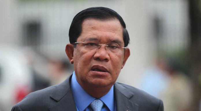 Cambodian PM threatens key rival with jail over sex scandal