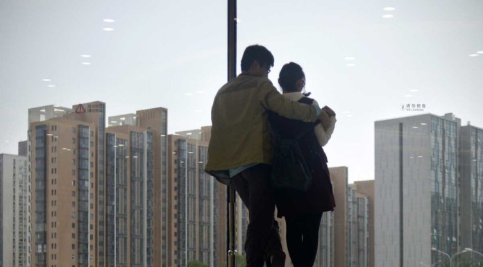 Holding hands ok, but China's college students frown on French kissing, stroking in public
