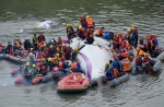 TransAsia Airways plane with 58 onboard lands in Taipei river - 28