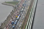 People cross Causeway by foot in massive traffic jam - 8