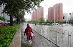 Hundreds of flights cancelled as heavy rains persist in Beijing - 12