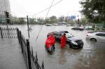 Hundreds of flights cancelled as heavy rains persist in Beijing - 13