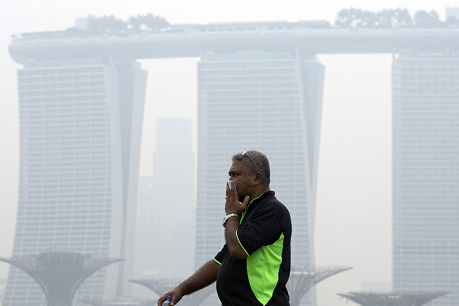 A man covers his nose during a hazy day in Singapore. Pic: AP