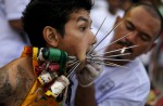 Gruesome piercing at bizarre Thai vegetarian festival - 2