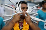 Gruesome piercing at bizarre Thai vegetarian festival - 3