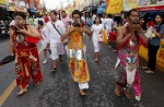 Gruesome piercing at bizarre Thai vegetarian festival - 5