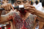 Gruesome piercing at bizarre Thai vegetarian festival - 9