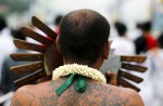 Gruesome piercing at bizarre Thai vegetarian festival - 8