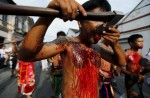 Gruesome piercing at bizarre Thai vegetarian festival - 10