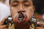 Gruesome piercing at bizarre Thai vegetarian festival - 14