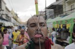 Gruesome piercing at bizarre Thai vegetarian festival - 29