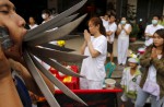 Gruesome piercing at bizarre Thai vegetarian festival - 30