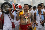 Gruesome piercing at bizarre Thai vegetarian festival - 28