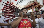 Gruesome piercing at bizarre Thai vegetarian festival - 31