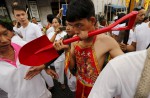 Gruesome piercing at bizarre Thai vegetarian festival - 37