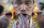 Gruesome piercing at bizarre Thai vegetarian festival - 38