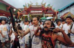 Extreme piercing for purity in Thai vegetarian festival - 13