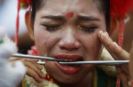Extreme piercing for purity in Thai vegetarian festival - 14