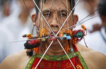 Extreme piercing for purity in Thai vegetarian festival - 17