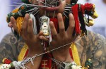 Extreme piercing for purity in Thai vegetarian festival - 28