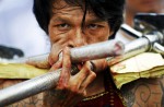 Extreme piercing for purity in Thai vegetarian festival - 36