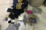 One budget airline passenger's badly damaged luggage and its contents - 12